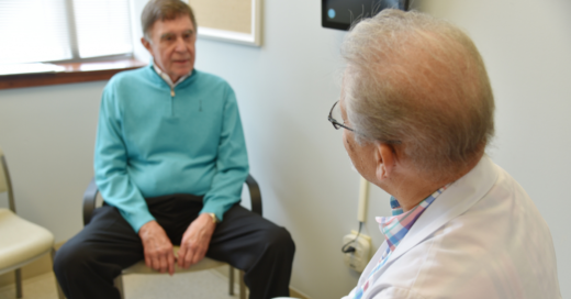 Dr. Locklear speaks with a patient in the Gaston Medical Partners office